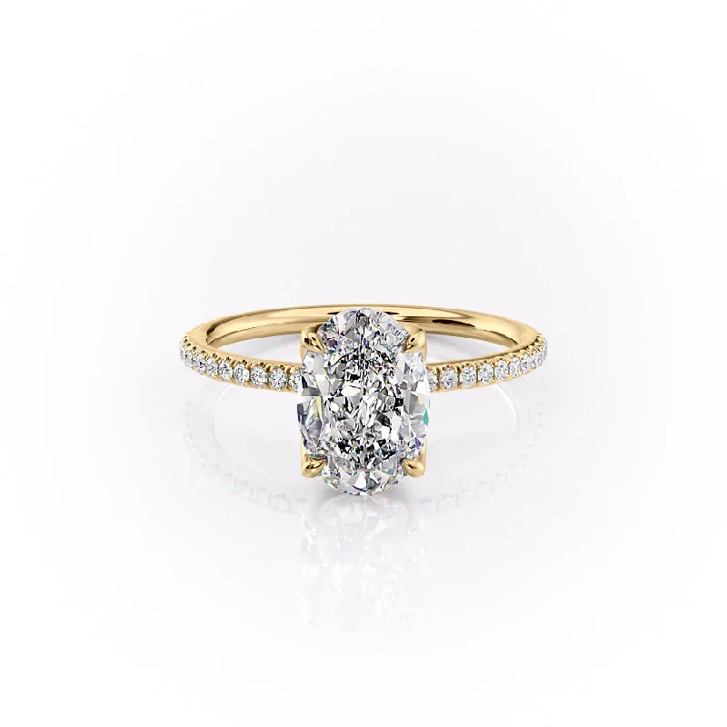 The Pave Lisa Set With A 1.5 Carat Oval Moissanite