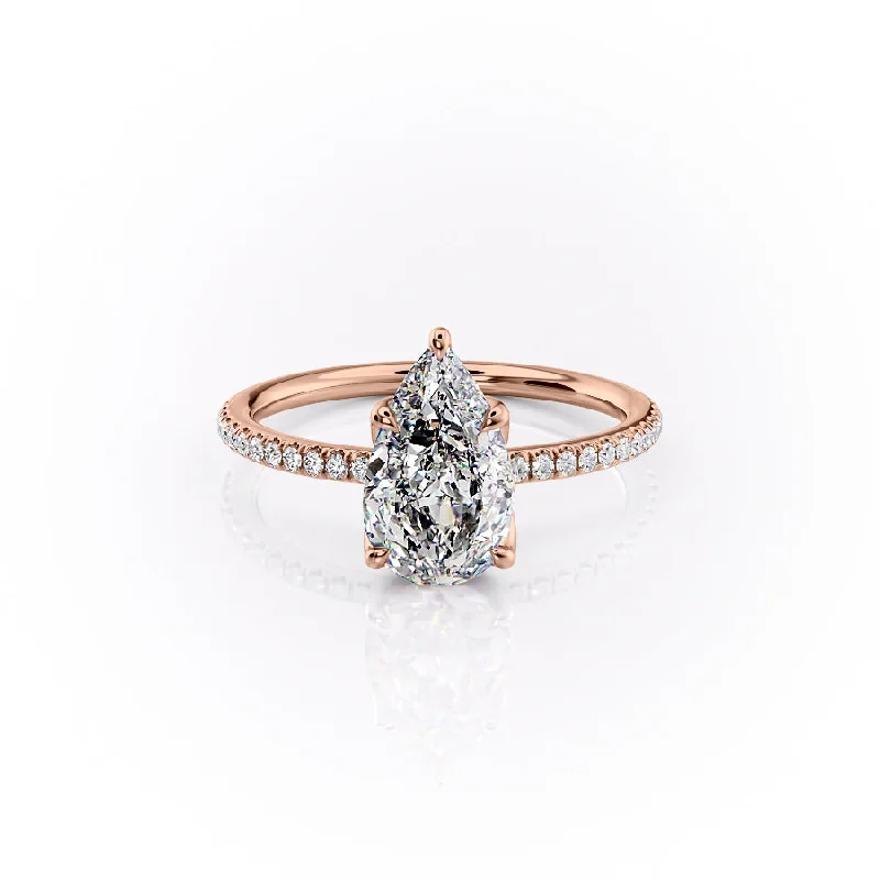 The Pave Lisa Set With A 1.5 Carat Pear Moissanite