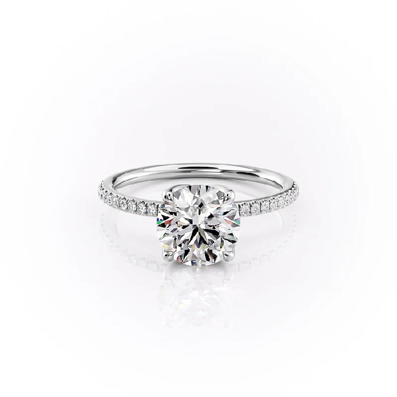 The Pave Lisa Set With A 1.5 Carat Round Moissanite