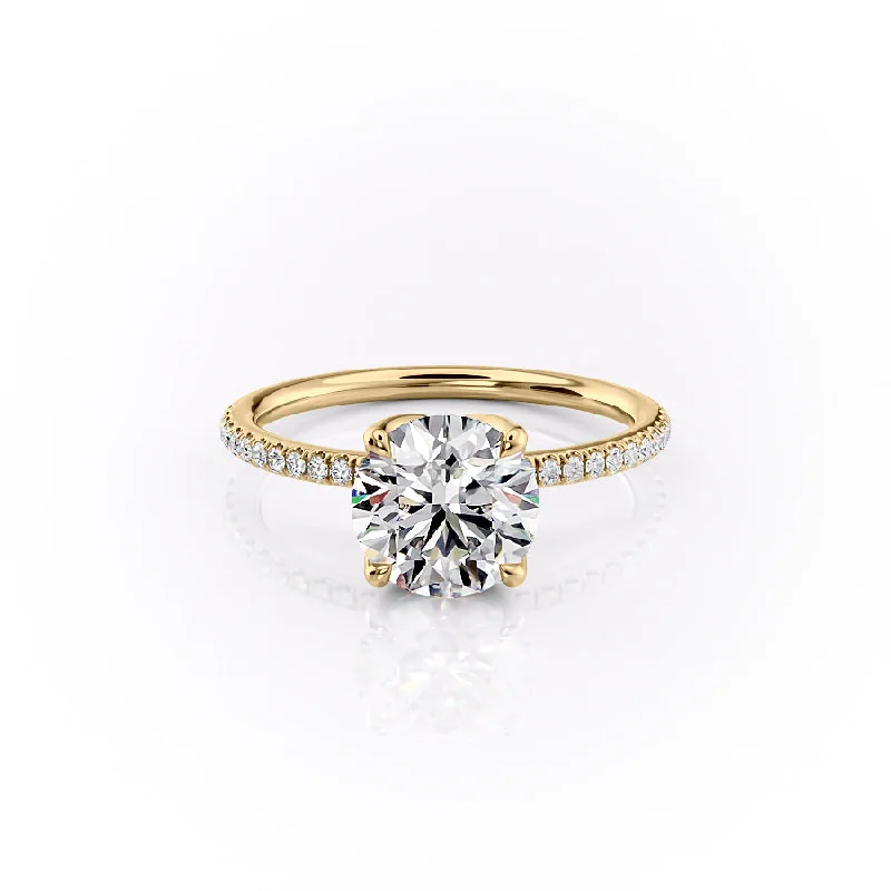 The Pave Lisa Set With A 1.5 Carat Round Moissanite